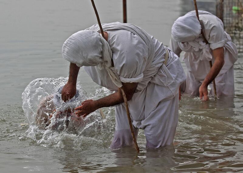 Mandaeans on the banks of the Tigris in Baghdad. Mandaeans trace their roots to pre-Christian times and some scholars believe the sect began as a heretical branch of Judaism that spread south through the land of the two rivers, or Mesopotamia, in the second century AD. AFP