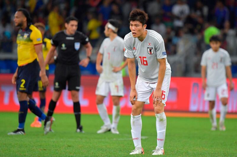 Japan's Takehiro Tomiyasu looks dejected after being eliminated from the 2019 Copa America in Brazil. EPA