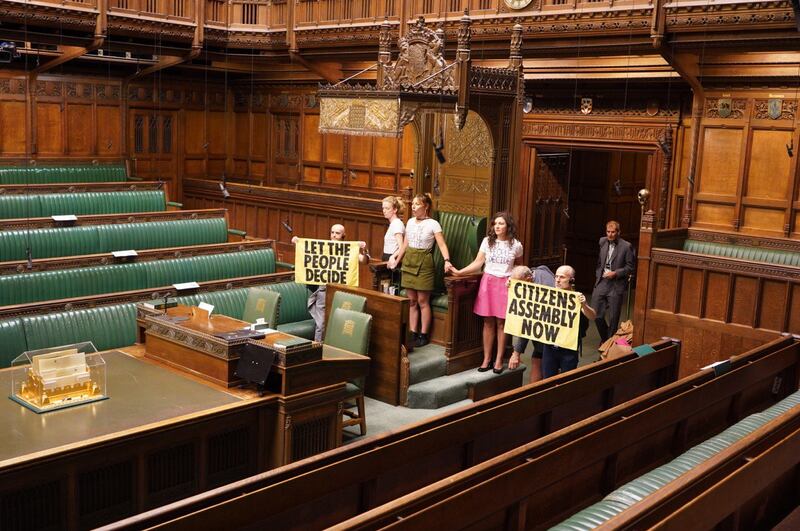 Members of Extinction Rebellion superglued themselves around the speaker's chair in the House of Commons on Friday. PA