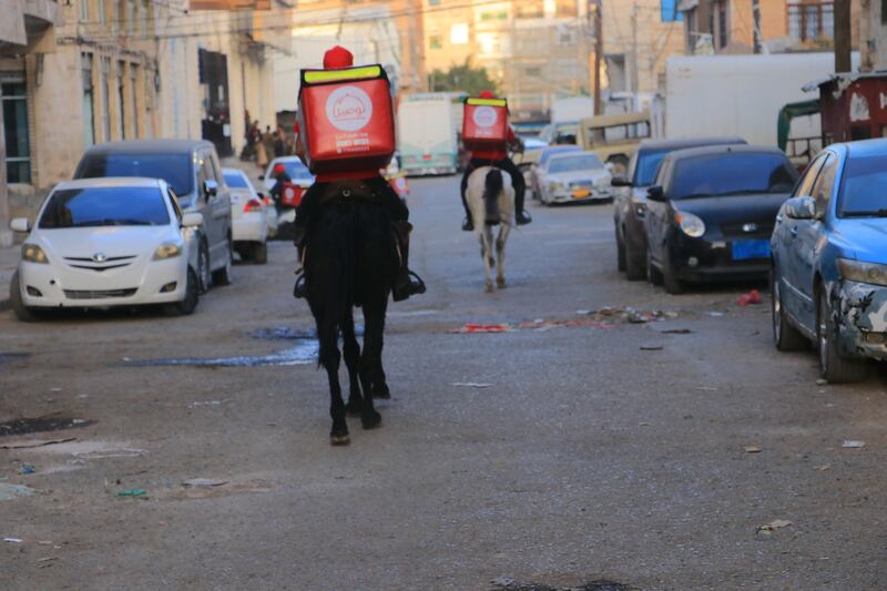 The delivery service, founded two years ago, has swapped its delivery motorcycles for horses because of severe fuel shortages caused by Yemen's civil war. Photo: Tawseel