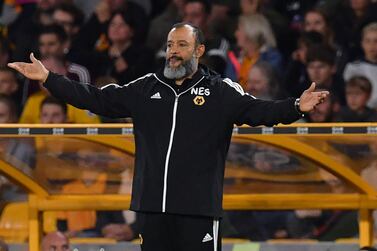 Wolverhampton Wanderers' Portuguese head coach Nuno Espirito Santo gestures during the English Premier League football match between Wolverhampton Wanderers and Manchester United at the Molineux stadium in Wolverhampton, central England on August 19, 2019. RESTRICTED TO EDITORIAL USE. No use with unauthorized audio, video, data, fixture lists, club/league logos or 'live' services. Online in-match use limited to 120 images. An additional 40 images may be used in extra time. No video emulation. Social media in-match use limited to 120 images. An additional 40 images may be used in extra time. No use in betting publications, games or single club/league/player publications. / AFP / Paul ELLIS / RESTRICTED TO EDITORIAL USE. No use with unauthorized audio, video, data, fixture lists, club/league logos or 'live' services. Online in-match use limited to 120 images. An additional 40 images may be used in extra time. No video emulation. Social media in-match use limited to 120 images. An additional 40 images may be used in extra time. No use in betting publications, games or single club/league/player publications.