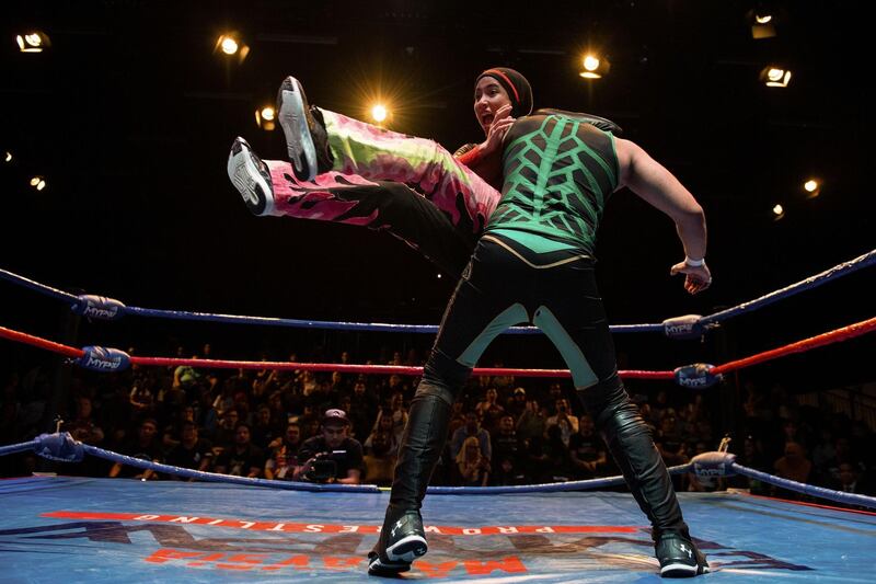 Nor "Phoenix" Dianawrestling with a male opponent during a match organised by Malaysia Pro Wrestling in Kuala Lumpur.