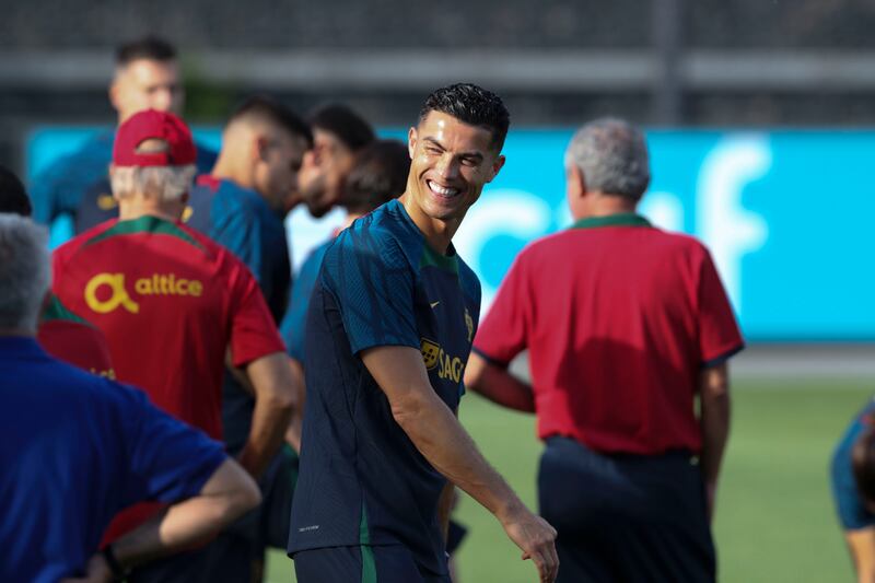 Portugal's Cristiano Ronaldo smiles during a training session at Cidade do Futebol in Oeiras, Portugal, 20 September 2022.  Portugal take on Czech Republic (Saturday) and Spain (Tuesday) in upcoming Uefa Nations League fixtures. EPA 