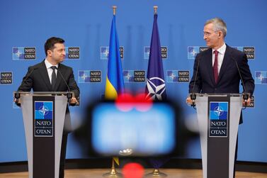 NATO Secretary General Jens Stoltenberg, right, and Ukraine's President Volodymyr Zelenskyy participate in a media conference at NATO headquarters in Brussels, Thursday, Dec.  16, 2021.  (AP Photo / Olivier Matthys)