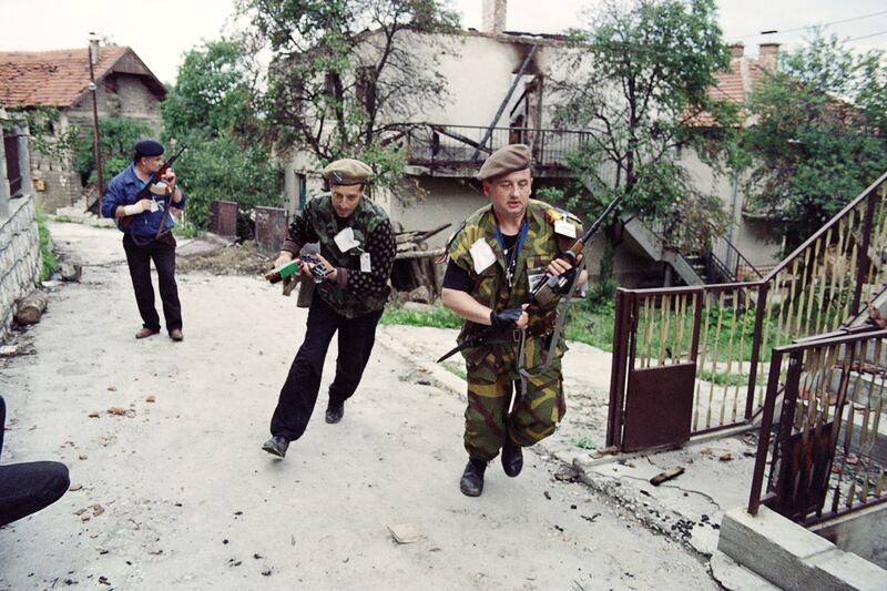 Bosnian fighters patrol in Sarajevo in June 1992. AFP
