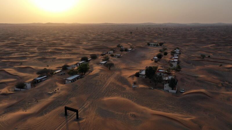 An aerial view of the abandoned village of Al Madam, which lies half-buried in the desert sand in Sharjah, UAE. AFP