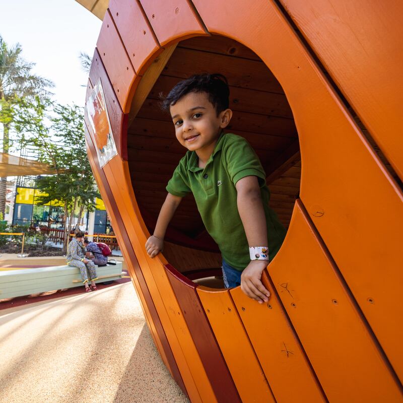 A child plays at Latifa's Adventures playground.