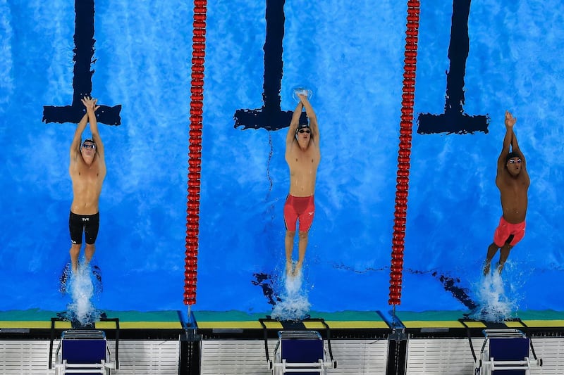 Nicholas Alexander (L) of United States, Daniel Carr (C) of United States and Yaziel Morales Miranda (R) of Puerto Rico compete in Men's 200m Backstroke Final A on Day 12 of Lima 2019 Pan American Games at Aquatic Center of Villa Deportiva Nacionalin Lima, Peru. Getty Images