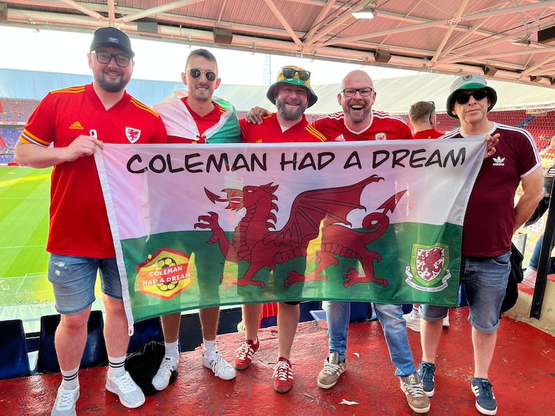 Wales fan Dai Rees (C), with fellow supporters, is looking forward to the World Cup finals. Photo: Dai Rees