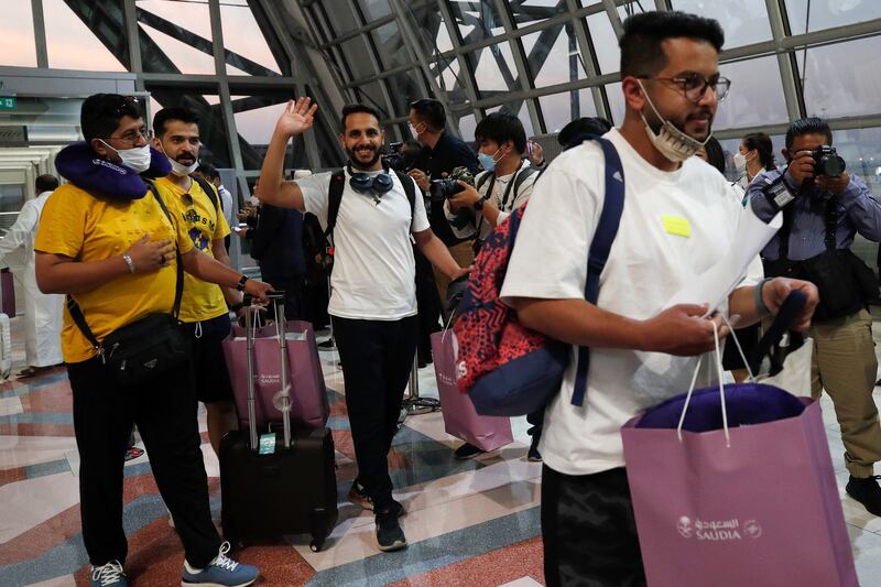 Passengers from Saudi Arabia are welcomed by Thai officials at Suvarnabhumi Airport in Samut Prakan province, near Bangkok on 28 February 2022. EPA
