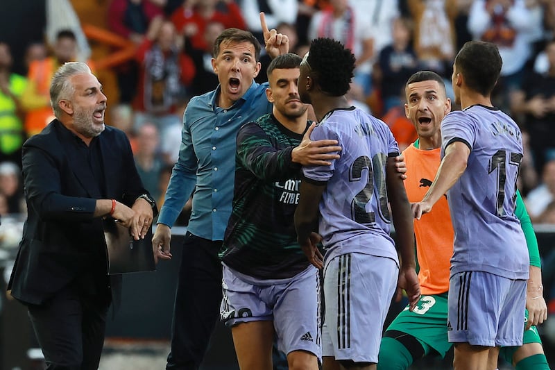 Real Madrid's Brazilian forward Vinicius Junior confronts the Valencia bench as he leaves the pitch after being sent off. AFP