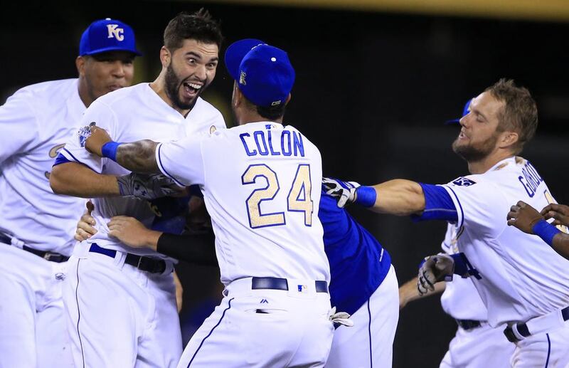 Kansas City Royals’ Eric Hosmer smiles big while celebrating with teammates following a baseball game against the Minnesota Twins at Kauffman Stadium in Kansas City, Missouri. Hosmer drove in the winning run. The Royals defeated the Twins 5-4 in 11 innings. Orlin Wagner / AP photo