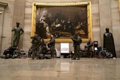 Police in riot gear sit in the rotunda of the U.S. Capitol in Washington, D.C., U.S., on Wednesday, Jan. 6, 2021. The House and Senate resumed a politically charged debate over the legitimacy of the presidential election hours after a pro-Trump mob stormed the U.S. Capitol and drove lawmakers from their chambers. Photographer: Stefani Reynolds/Bloomberg