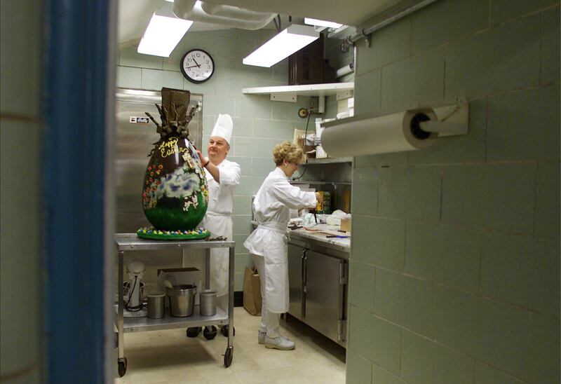 White House pastry chef Roland Mesnier puts the finishing touches on a 23kg chocolate Easter egg for the annual White House Easter Egg Roll on April 13, 2001. Photo: Newsmakers 