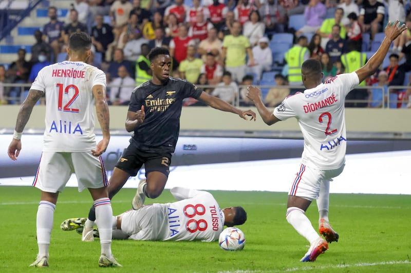Arsenal midfielder Albert Sambi Lokonga challenges for the ball against Lyon defender Sinaly Diomande and midfielder Corentin Tolisso. AFP