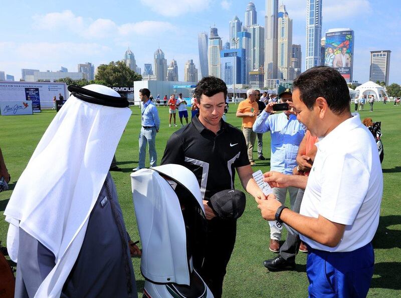 DUBAI, UNITED ARAB EMIRATES - FEBRUARY 03:  His Royal Highness Prince Rachid of Morocco (r) is presented with a set of Nike Golf clubs and a hand written note by Rory McIlroy of Nortehrn Ireland and a 'Golf in Dubai' golf bag by Mohamed Juma Buamaim The Deputy Chairman and Ceo of Golf in Dubai during the pro-am as a preview for the 2016 Omega Dubai Desert Classic on the Majlis Course at the Emirates Golf Club on February 3, 2016 in Dubai, United Arab Emirates.  (Photo by David Cannon/Getty Images)