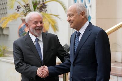 Brazilian President Luiz Lula da Silva, left, shakes hands with Arab League Secretary-General Ahmed Aboul Gheit as he arrives at the Arab League headquarters in Cairo. AP Photo
