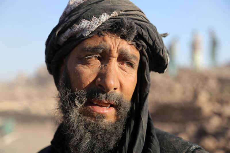 A man waits for aid to arrive in the Zinda Jan district of Herat, Afghanistan. EPA