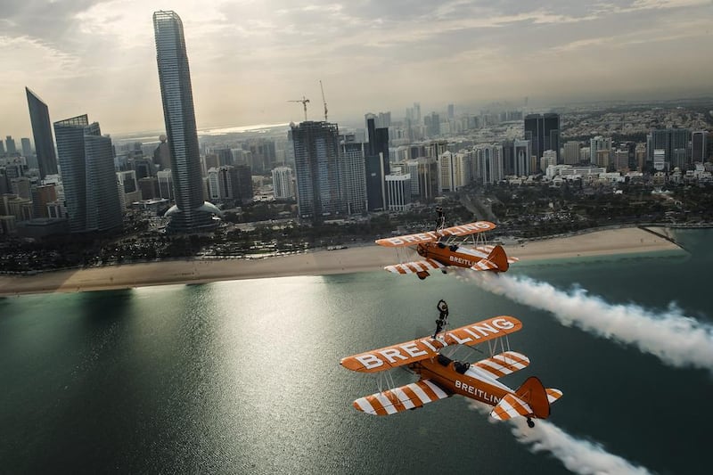 The Breitling Wingwalkers team perform in close formation over the Abu Dhabi skyline. Joerg Mitter / Breitling SA via AP Images