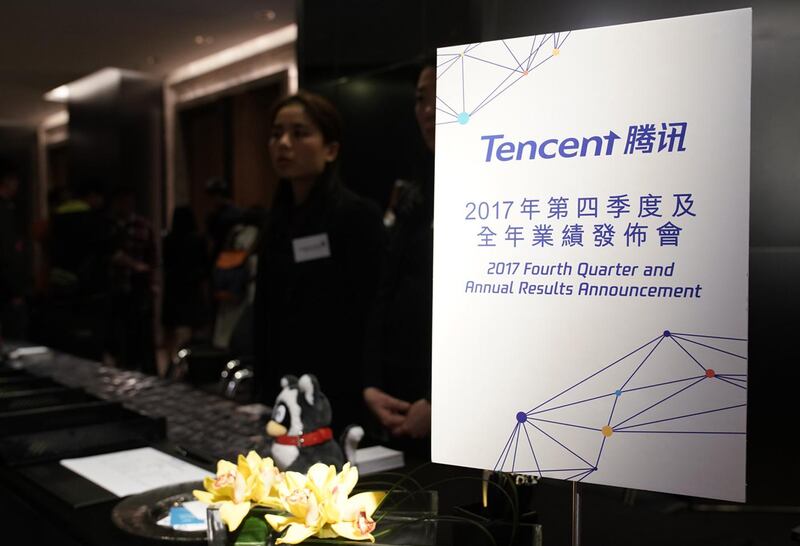 Signage is displayed prior to a Tencent Holdings Ltd. news conference in Hong Kong, China, on Wednesday, March 21, 2018. Tencent posted quarterly profit that beat estimates, bolstered by mobile game blockbusters like Honour of Kings and a growing ad business. Photographer: Anthony Kwan/Bloomberg