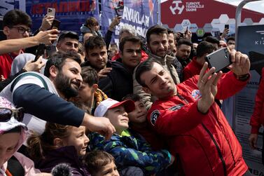 Selcuk Bayraktar, chairman of Turkish defence firm Baykar, takes a selfie with visitors at Teknofest airshow in Istanbul, Turkey, April 28, 2023.  REUTERS / Umit Bektas