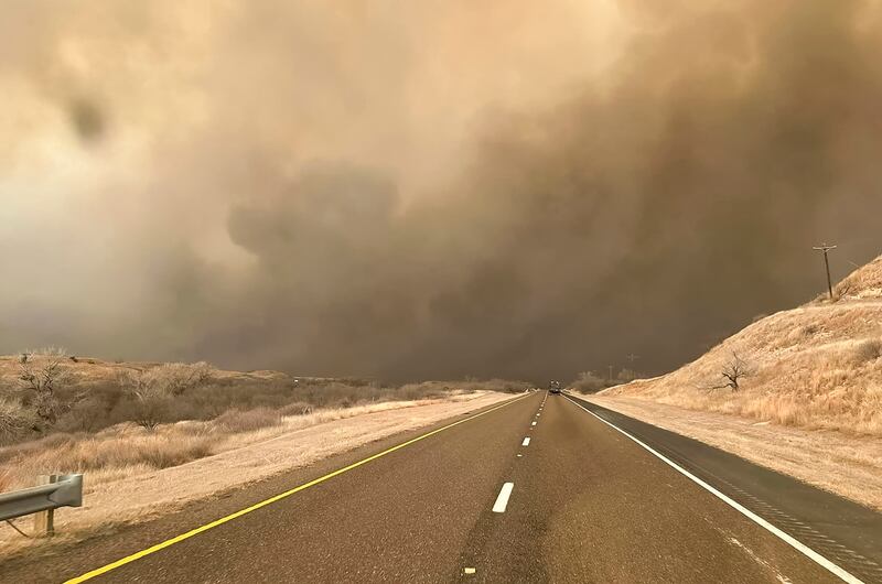 Smoke from the Windy Deuce wildfire billows across a road in the panhandle region of Texas. EPA
