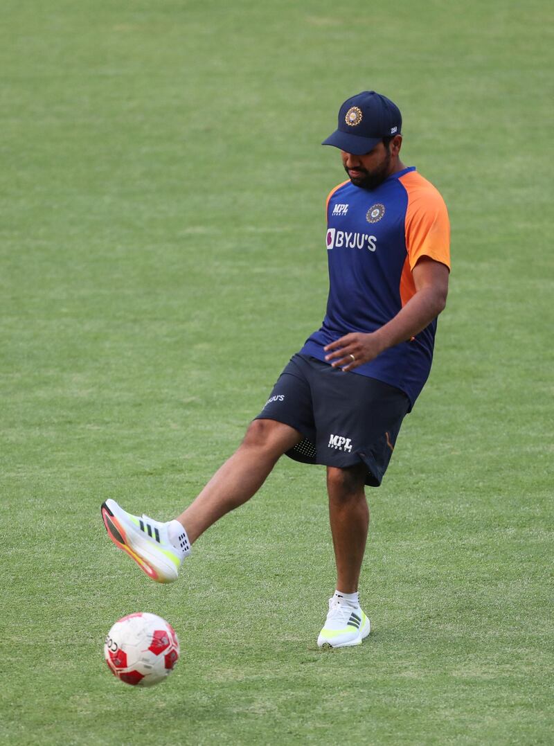 India batsman Rohit Sharma playing football at training. AP