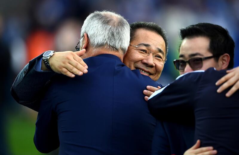 LEICESTER, ENGLAND - MAY 07:  Claudio Ranieri (L) Manager of Leicester City hugs with owner Vichai Srivaddhanaprabha (C) and his son Aiyawatt Srivaddhanaprabha (R) to celebrate the season champions after the Barclays Premier League match between Leicester City and Everton at The King Power Stadium on May 7, 2016 in Leicester, United Kingdom.  (Photo by Laurence Griffiths/Getty Images)