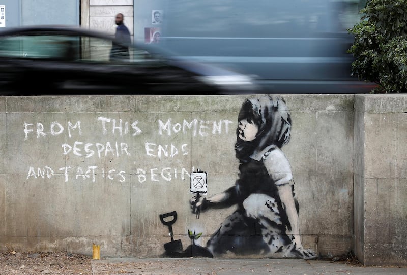 A graffiti believed to have been created by street artist Banksy is seen at Marble Arch in London, Britain. Reuters