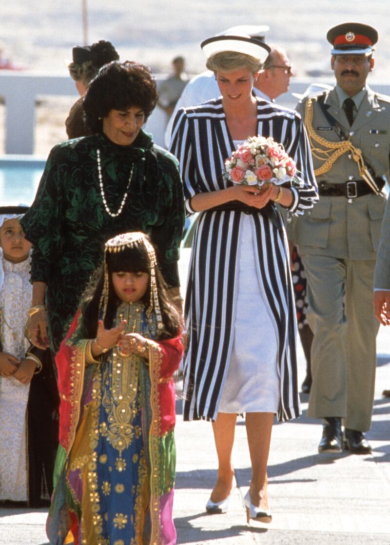 The princess, wearing a navy blue and white striped outfit designed by Emanuel and a matching hat, arrives to visit the Hope Institute for Special Education in Isa Town, Bahrain, on November 16, 1986. 