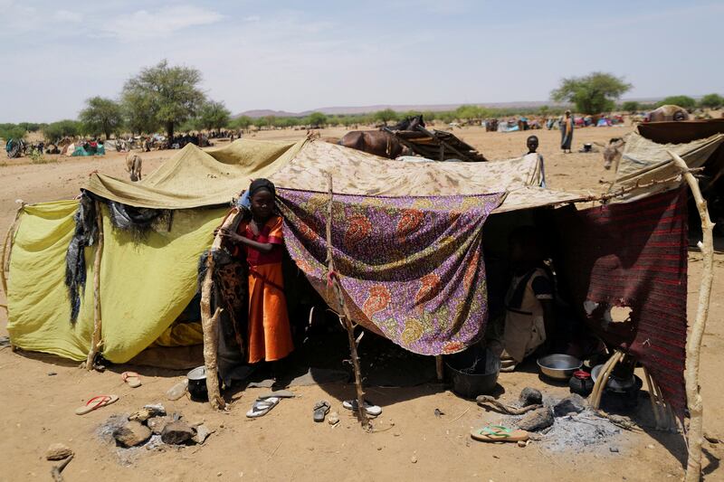 A Sudanese girl at her family's makeshift shelter across the border in Koufroun, Chad. Reuters