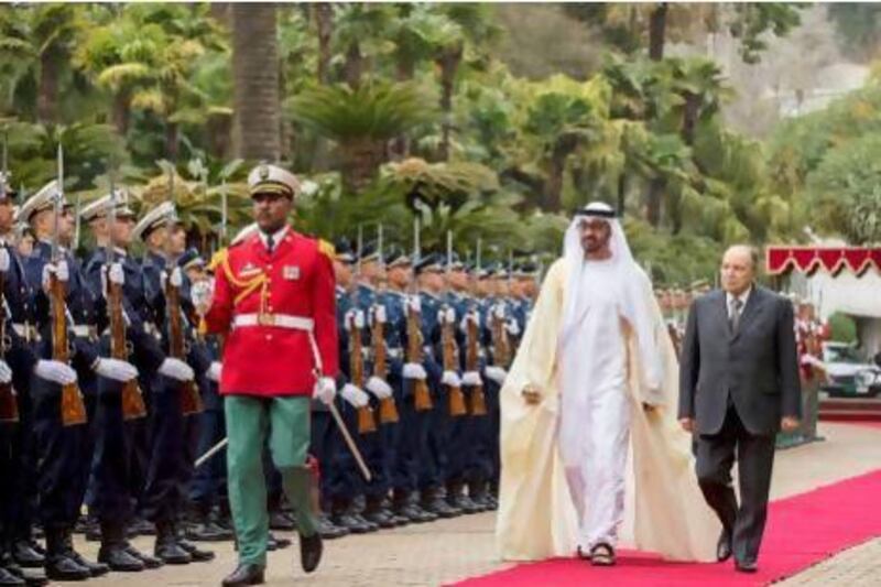 General Sheikh Mohamed bin Zayed Al Nahyan, Crown Prince of Abu Dhabi and Deputy Supreme Commander of the UAE Armed Forces (2nd right), inspects the honour gaurd with Abdelaziz Bouteflika, President of Algeria (right), at the Presidential palace while in Algiers for an official visit.. Courtesy Ryan Carter, Crown Prince Court