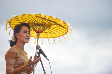 (FILES) In this file photo taken on September 5, 2015, National League for Democracy chairperson Aung San Suu Kyi delivers a speech during a voter education campaign at the Hsiseng township in Shan State.  - Ousted Myanmar leader Aung San Suu Kyi has been moved from house arrest to solitary confinement in a prison compound in the military-built capital Naypyidaw, a junta spokesman said on June 23, 2022.  (Photo by AFP)