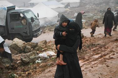 A Syrian woman in the governorate of Idlib. The woman is among thousands of civilians who have fled a Russian-backed offensive by the regime on the rebel town of Maaret Al Numaan in the south of the province December 27, 2019. AFP 