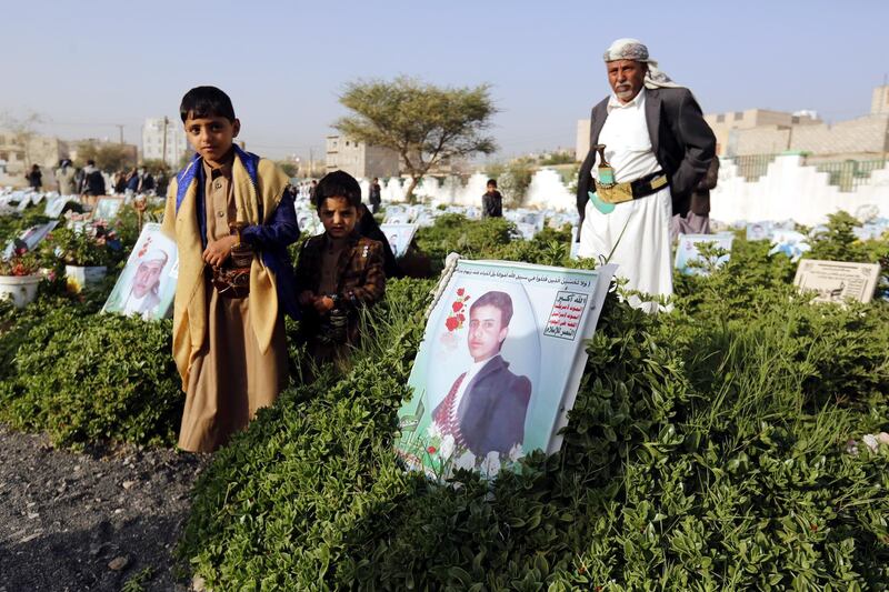 Yemenis visit the graves of relatives in the capital Sanaa on the first day of Eid Al Fitr.