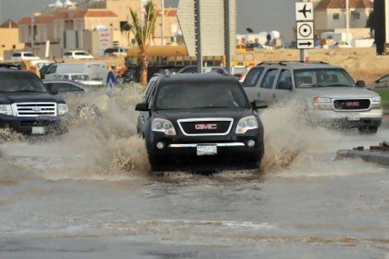 A flooded street in the north of the Saudi capital, Riyadh. Sixteen people have died and three more are missing in Saudi Arabia after downpours caused flash floods in several areas of the kingdom.
