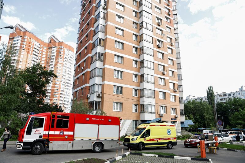 An ambulance and fire engine outside an apartment block in Moscow. Reuters