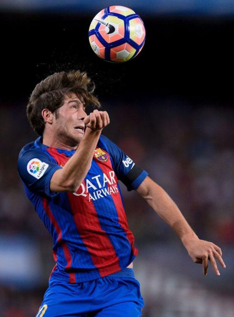 Barcelona’s midfielder Sergi Roberto heads the ball during the match against Atletico Madrid. Josep Lago / AFP
