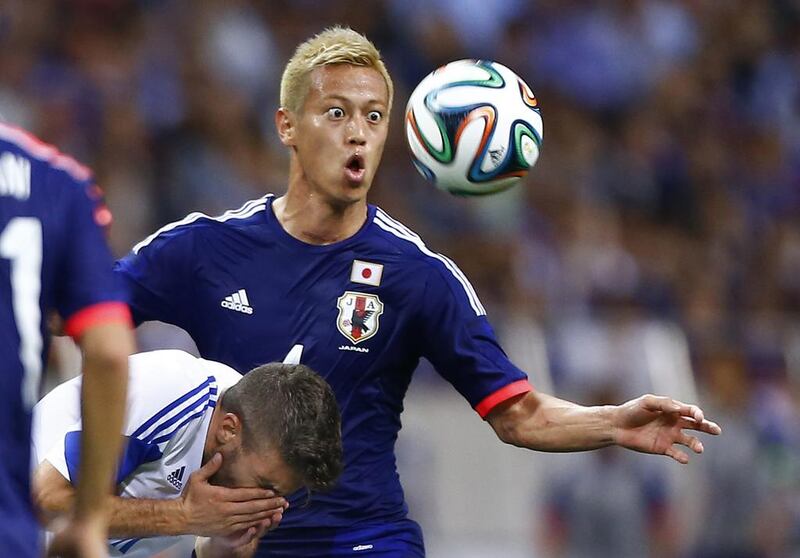 Keisuke Honda will spearhead the attack for Japan, who are in Group C. Shizuo Kambayashi / AP Photo