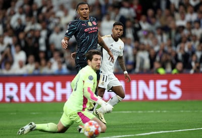 Manuel Akanji of Manchester City looks on as Rodrygo of Real Madrid scores his team's second goal past Stefan Ortega. Getty 