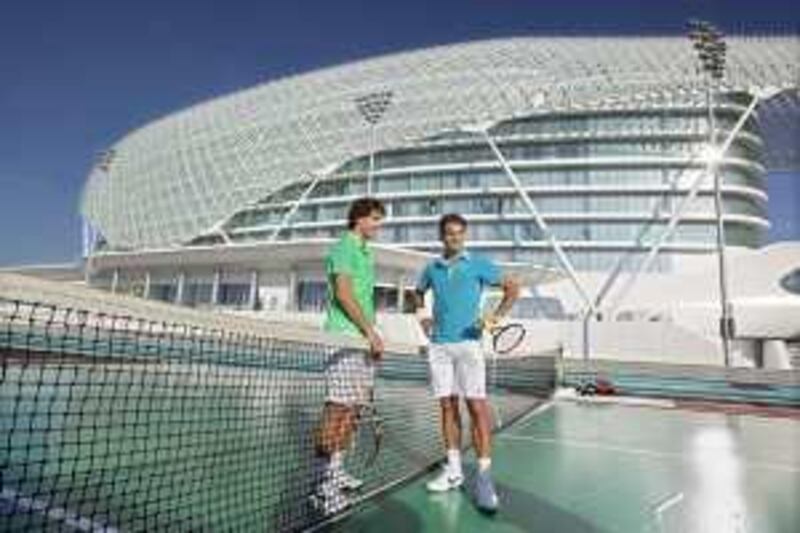 United Arab Emirates - Abu Dhabi - Dec 31 - 2009 : Roger Federer (right) and Rafael Nadal pose for the media after play tennis on the F1 track on Yas Island Hotel.  ( Jaime Puebla / The National ) *** Local Caption ***  JP Capitala 06.jpg