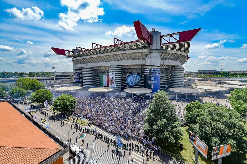 Inter supporters celebrate outside the San Siro before the match. EPA