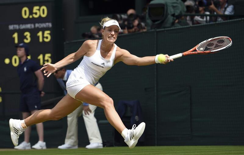 Angelique Kerber of Germany returns to Venus Williams of the US during their women’s singles match on day eleven of the Wimbledon Tennis Championships in London, Thursday, July 7, 2016. (Gerry Penny/Pool Photo via AP)