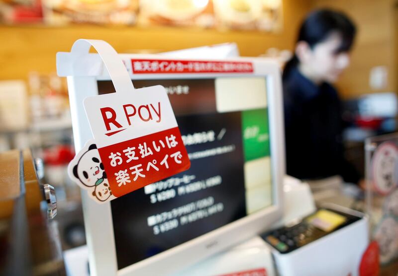 A campaign advertising of Rakuten Pay, a QR code mobile payment system operated by Rakuten, is displayed at a coffee shop in Tokyo, Japan May 30, 2019. Picture taken May 30, 2019.  REUTERS/Issei Kato