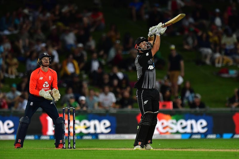 New Zealand's Daryl Mitchell wacthes his shot land in the hands of England fielder Tom Banton as he is out for 14. AFP