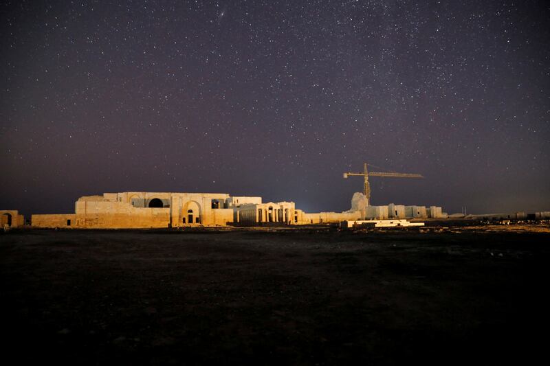 A crane right next to the Temple of Allat, which is located in the ancient city of Hatra. Reuters