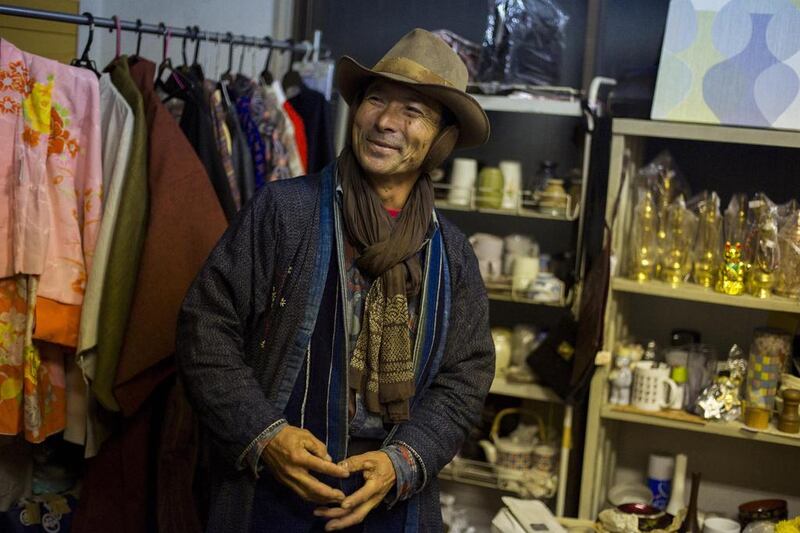 Yoshiyuki Matsuura, a regular customer, visits a friend’s indoor secondhand clothes store at Boroichi flea market in Tokyo. Thomas Peter / Reuters