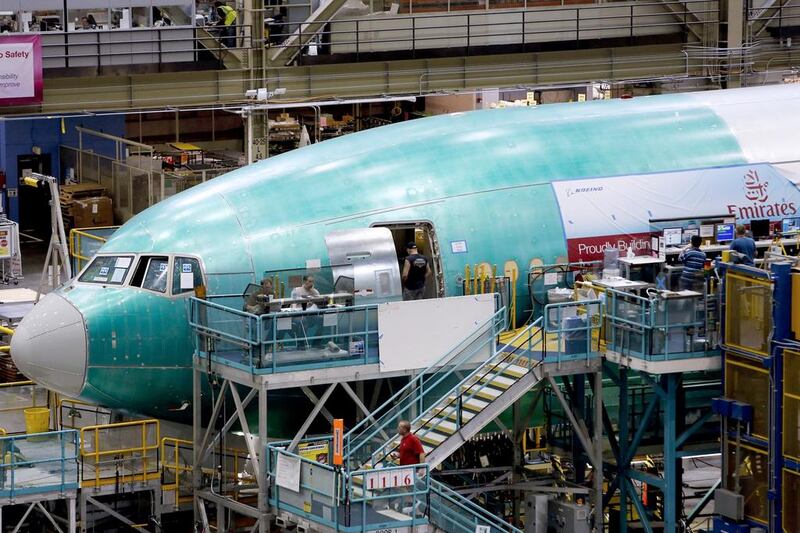 Employees work on the final assembly line of a Boeing 777 airplane for Emirates Airlines at the Boeing factory in Everett, Washington. Patrick Fallon / Bloomberg