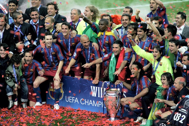 PARIS - MAY 17:  Ronaldinho (C) of Barcelona holds the trophy alongside celebrating team mates after they win the UEFA Champions League Final between Arsenal and Barcelona at the Stade de France on May 17, 2006 in Paris, France.  (Photo by Martin Rose/Bongarts/Getty Images)