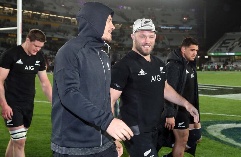 New Zealand's Owen Franks (C) and Sonny Bill Williams (front L) walk off after their victory in the second rugby Test match between New Zealand and Australia at Eden Park in Auckland on August 25, 2018. (Photo by MICHAEL BRADLEY / AFP)